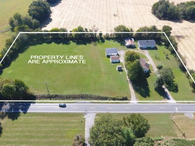 ABSOLUTE AUCTION!  HOME, +/- 4 ACRES, 2 GARAGES, & FINISHED SHOP!